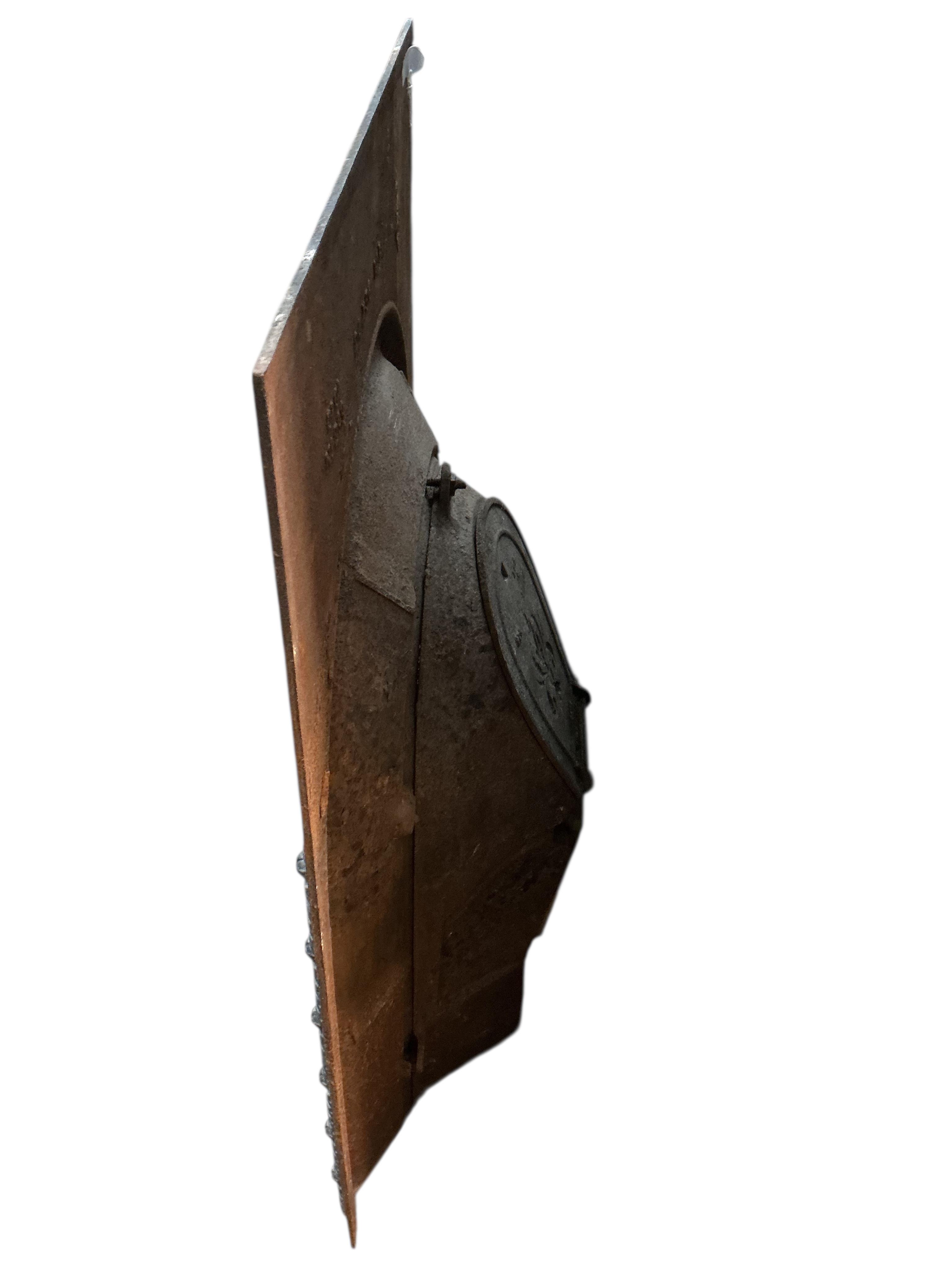 A Victorian cast iron fireplace, width 61cm, height 92cm